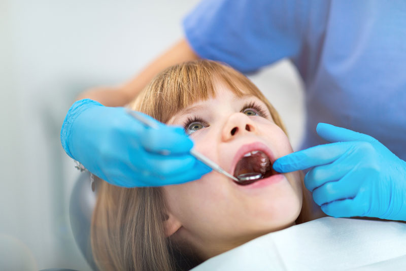 pediatric patient undergoing dental procedure