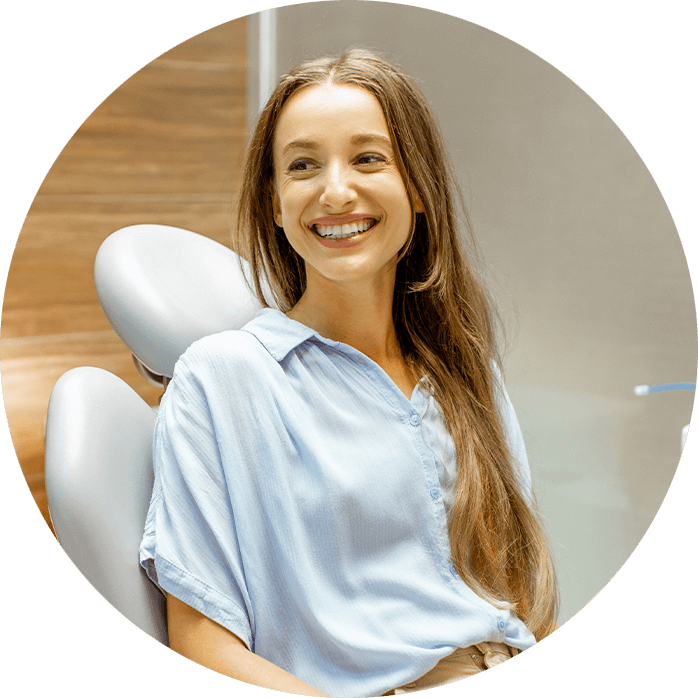 cosmetic dentistry patient smiling in exam chair