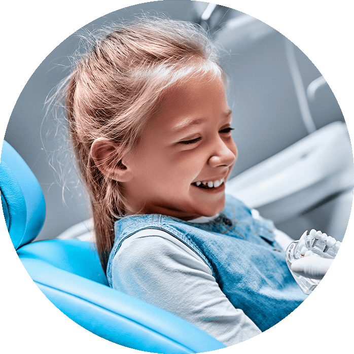 pediatric dentistry patient patient smiling in exam chair