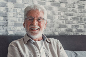 denture patient smiling after procedure
