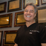 Doctor smiling within the dental practice