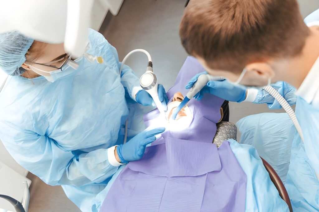 Dental team performing oral surgery procedure with modern tools and gentle methods in Woodland Hills,